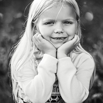 Black and white portrait of a smiling girl