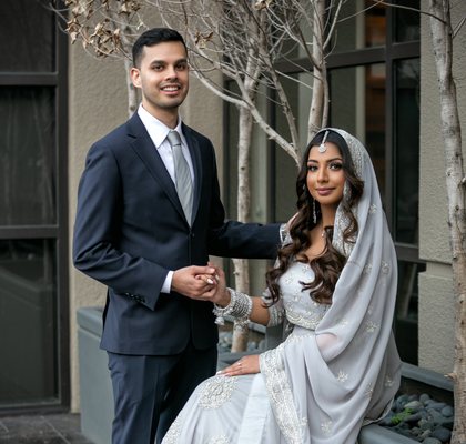 Engaged couple holding hands in traditional attire