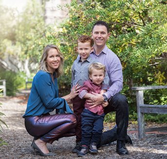 Family with two boys in a garden